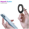 A hand holds a silver magnetic phone holder stand designed for an iPhone.