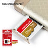 A close-up of a MicroDrive PRO PLUS 128GB memory card inserted into a device slot.