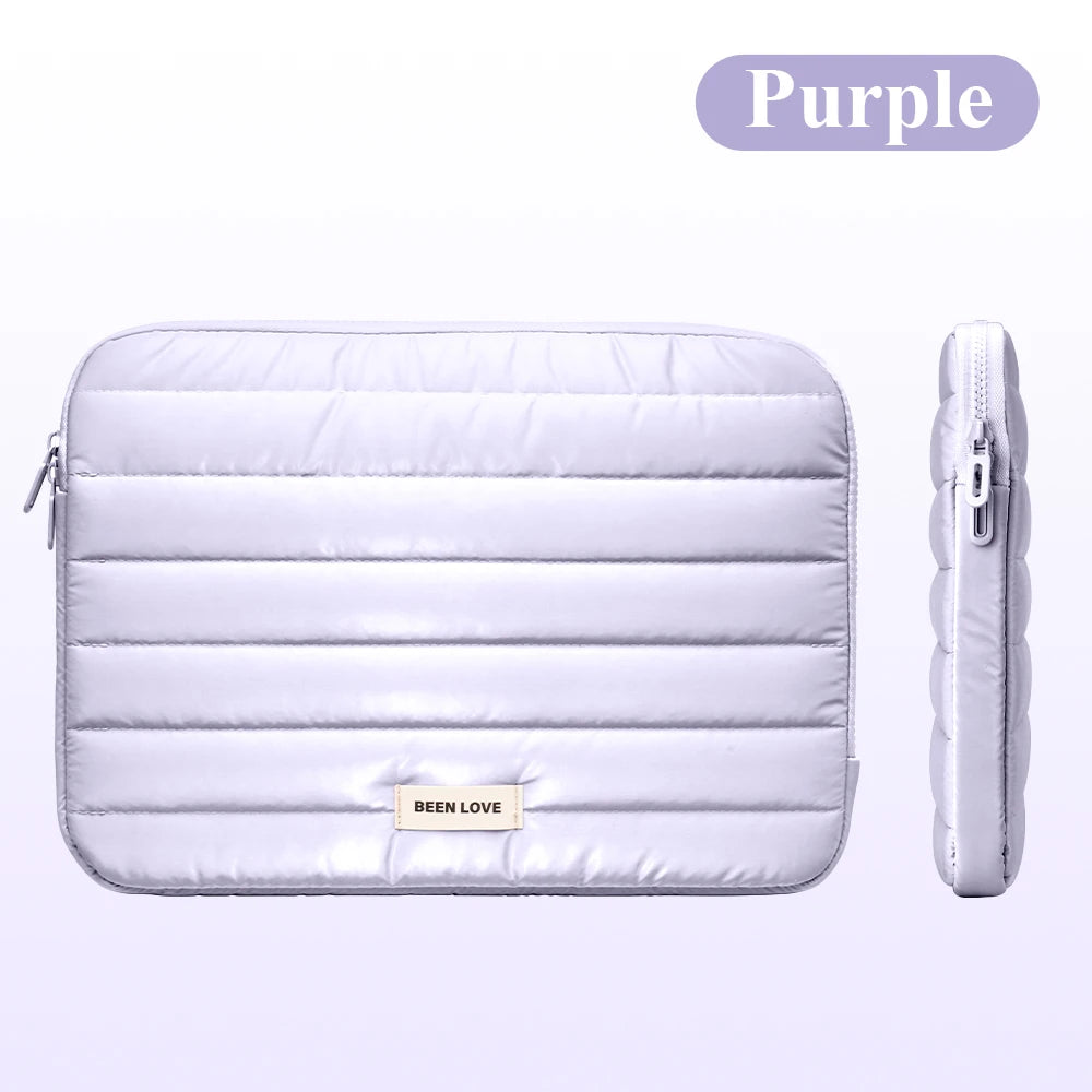 A purple padded laptop sleeve for a MacBook, iPad, or tablet is shown with a zipper closure.