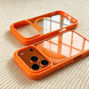 An orange transparent acrylic phone case with a MagSafe compatible frame and multiple camera lenses is shown on a light backg