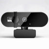 A black webcam device with a lens and power switch is shown against a light gray background.