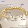 A gold-plated shell pearl beaded bracelet with copper layers shown on a light background.