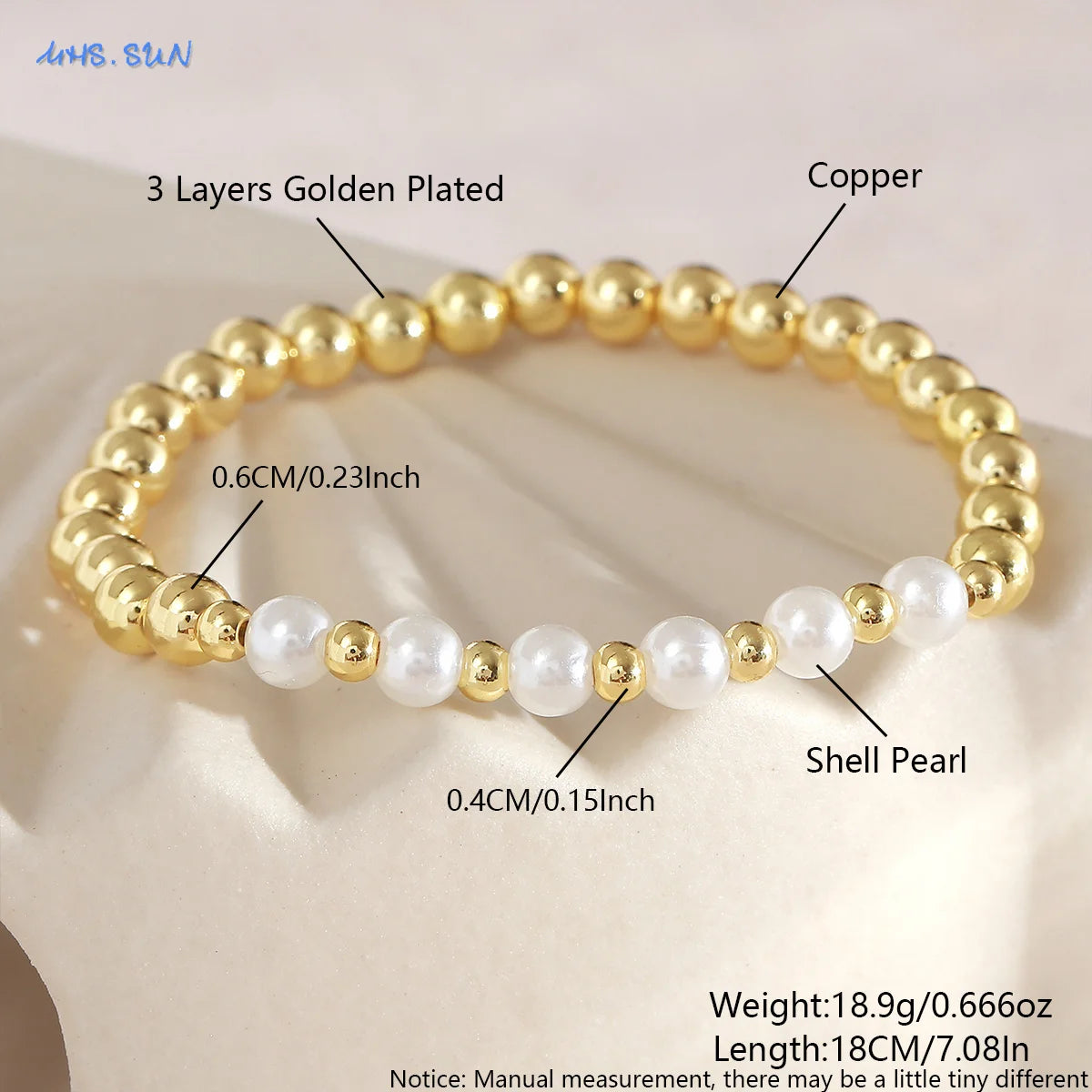 A gold-plated shell pearl beaded bracelet with copper layers shown on a light background.