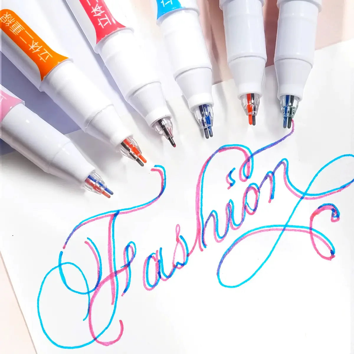A collection of six line marker pens in various colors and tips are displayed on a white background.