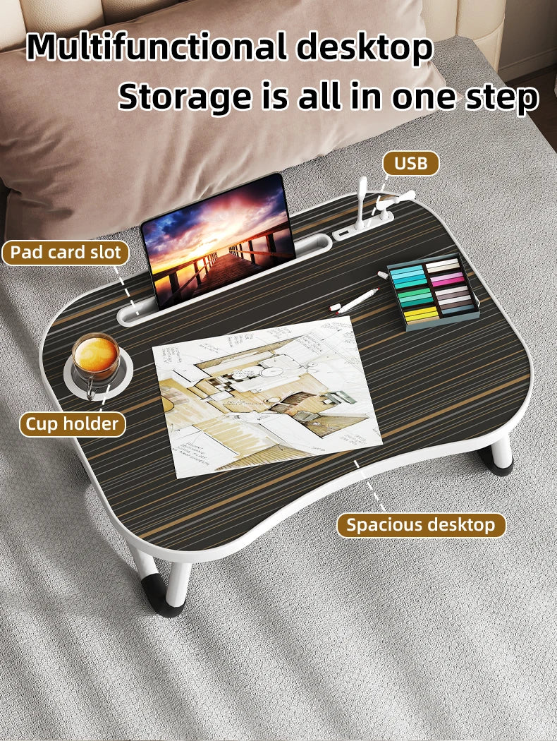 A laptop desk organizer tray featuring a USB slot, pad card slot, cup holder, and storage for pens and paper on a gray fabric