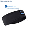 Black upgraded version of a wireless sports and sleep headband with blue accents.