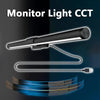A monitor light cct fixture with a flexible cord and blue light beam illuminating a surface.