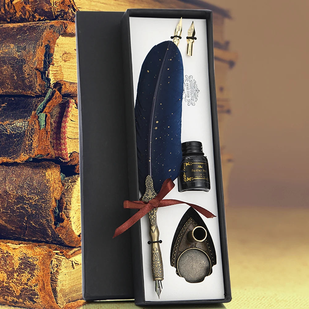 A black gift box containing a feather dip pen set with a decorative knife and a small ink bottle.