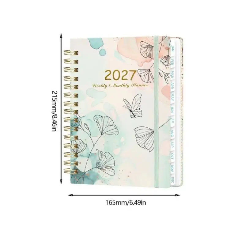 A spiral bound planner featuring watercolor floral designs and monthly tabs for planning.