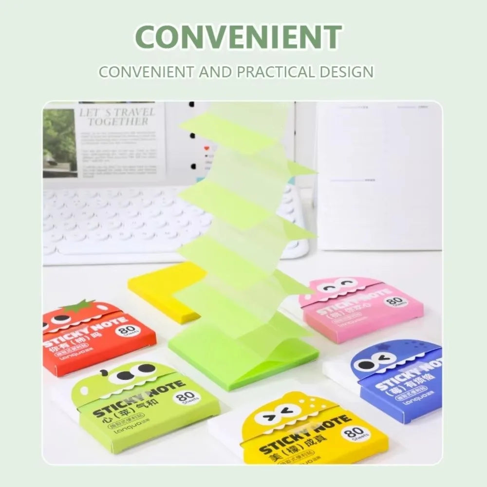 A set of cartoon fruit pearlescent pull-out sticky notes in various colors like yellow, pink, and green are displayed on a wh
