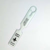 A clear plastic luggage tag with a loop for attachment and text reading Happy Flight to your dream city.