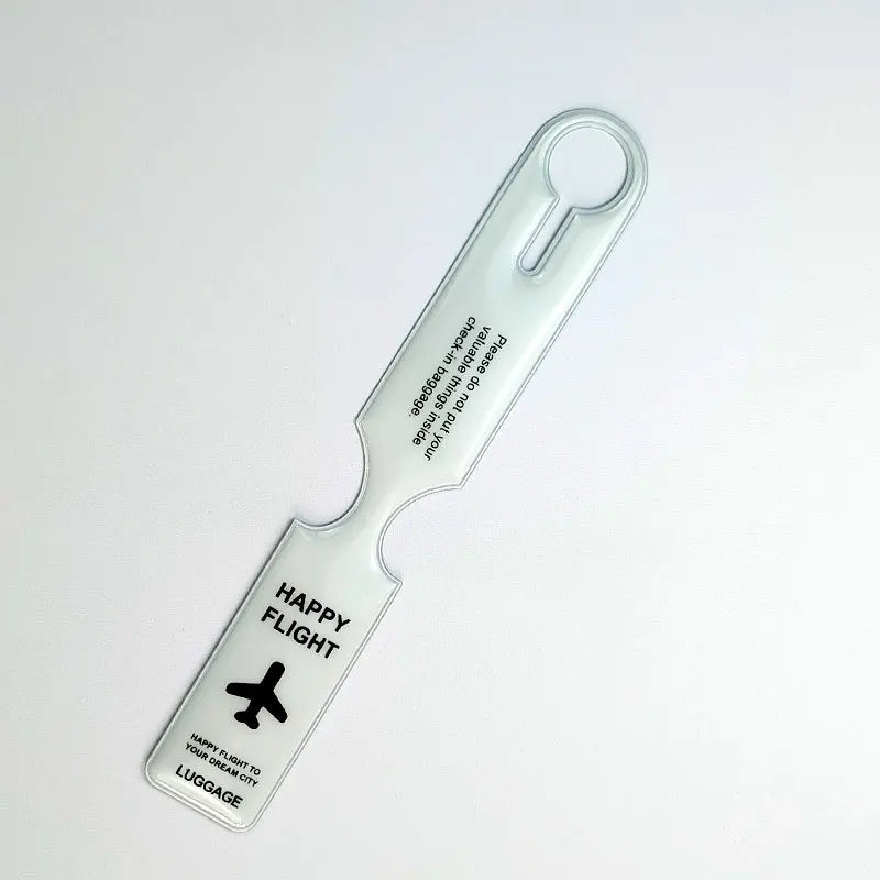 A clear plastic luggage tag with a loop for attachment and text reading Happy Flight to your dream city.