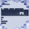 A close-up view of a mechanical keyboard featuring light blue and white keycaps, set against a background of icebergs.