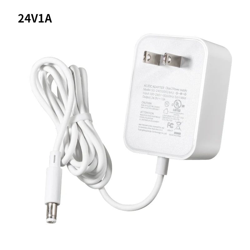 A white universal DC switching power adapter with a cord and plug.
