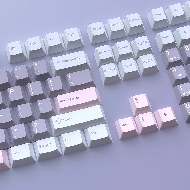A collection of light purple and white PBT keycaps for MX Mechanical keyboards arranged in rows.