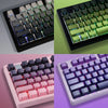 A set of gradient PBT keycaps for mechanical keyboards shown in various colors including green, pink, and purple.