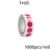 A roll of round dot labels in assorted colors for organization