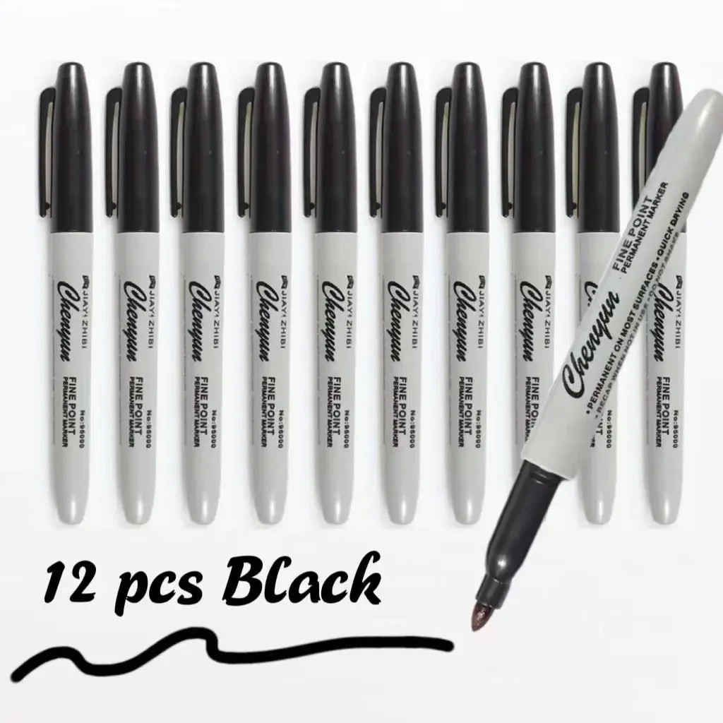 A set of twelve black permanent markers arranged in a row.