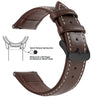A brown genuine leather watch band featuring quick release spring bars and a slide lever for easy strap attachment.