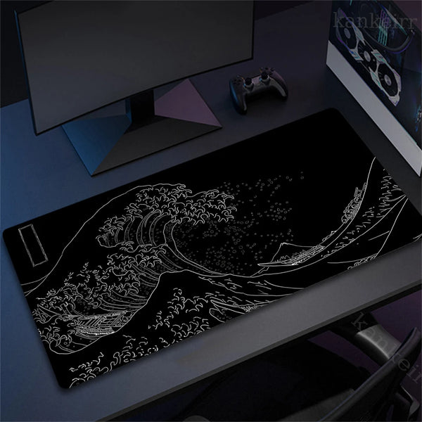 A black desk mat mousepad featuring a white line art illustration of a large ocean wave.