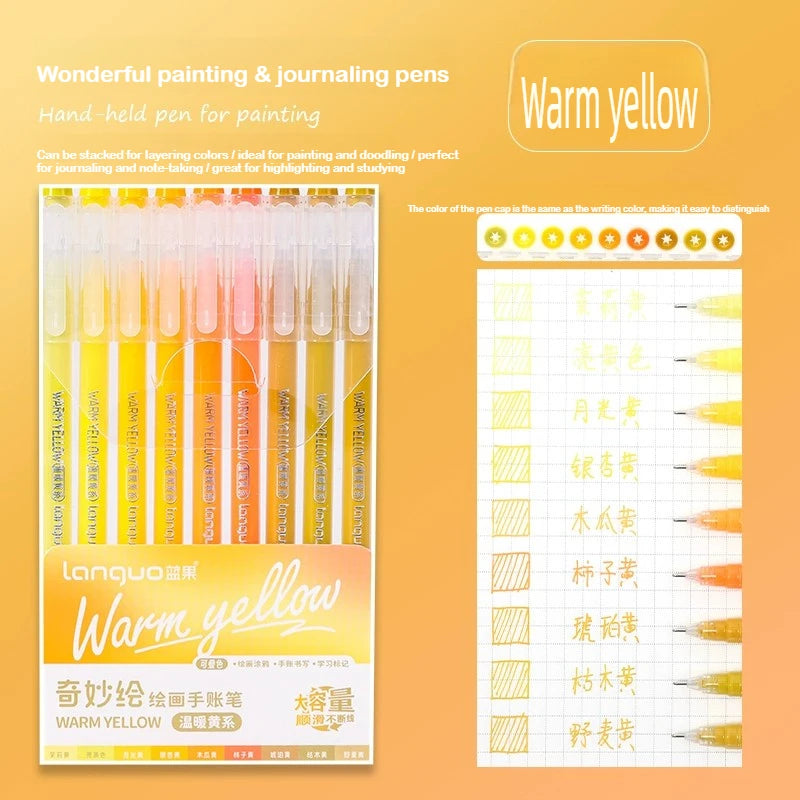 A set of watercolor painting and journaling pens in warm yellow shades displayed in a packaging box.