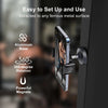 A close-up of a black magnetic phone holder attached to a door, demonstrating its easy setup and 360-degree rotation.