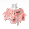 A pink linear mechanical keyboard switch with a white housing and mounting plate.