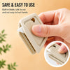 A hand holds a beige mini ceramic box cutter with an auto-retractable blade, demonstrating its safe and easy to use design.