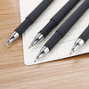 A close-up view of a bulk pack of black gel ink pens lying on a white lined notepad.