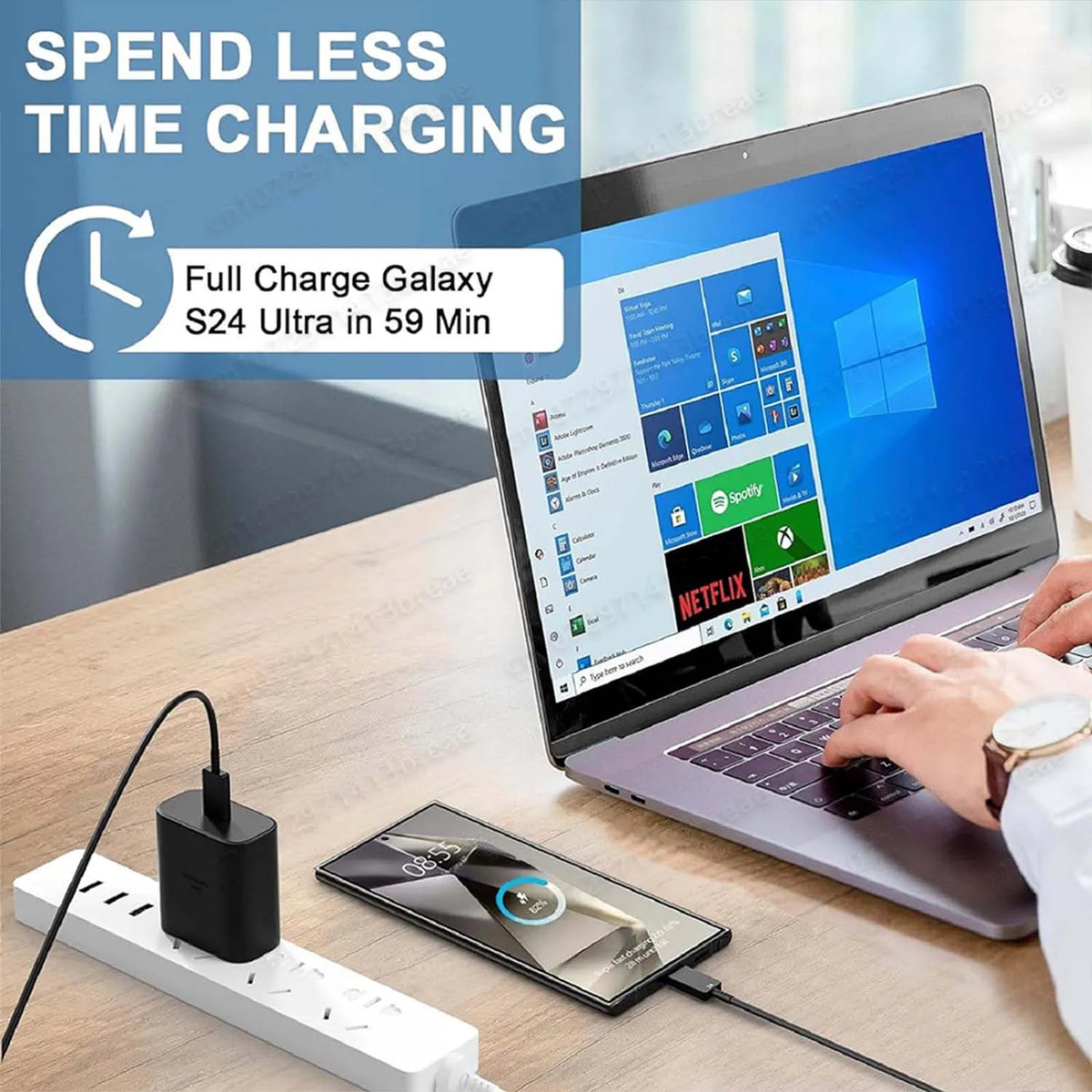 A laptop is shown next to a mobile device and a charger, demonstrating fast charging capabilities.