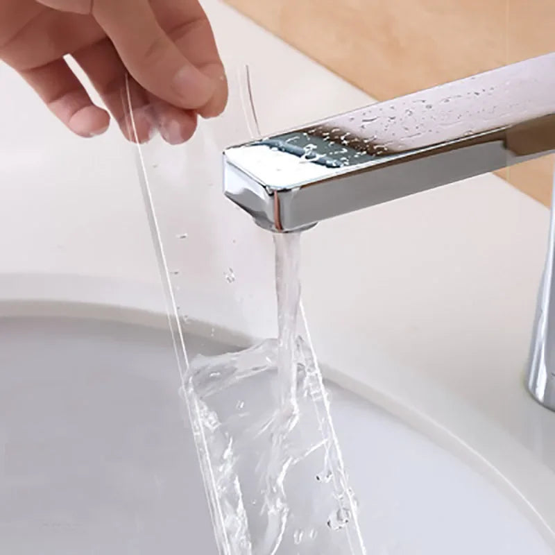 A hand is applying heavy duty double-sided nano adhesive tape to a faucet, with water dripping from the tap.