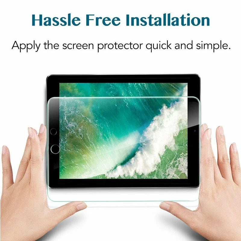 Hands apply a clear tempered glass screen protector to an iPad screen.