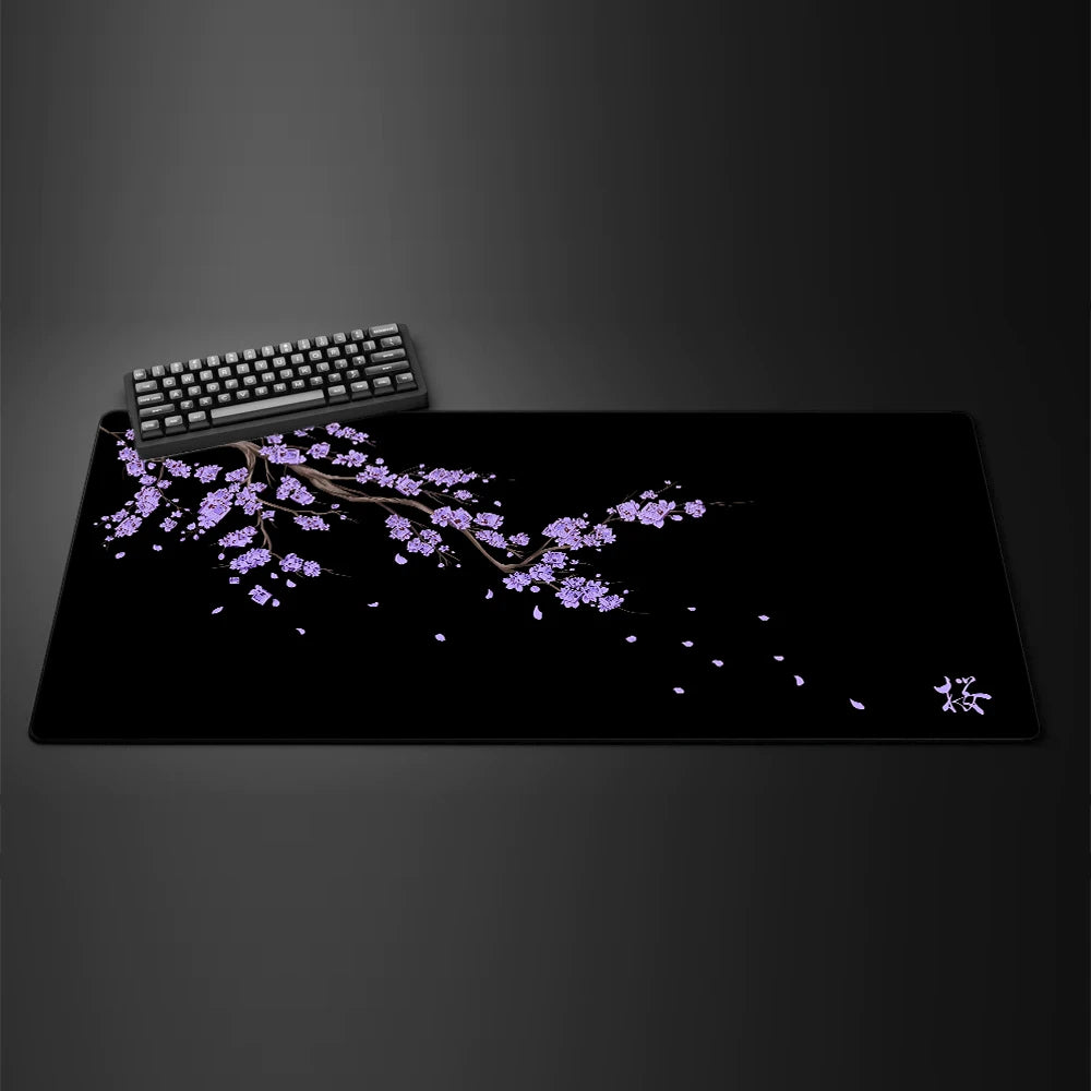 Black gaming mouse pad featuring a delicate purple cherry blossom branch design.