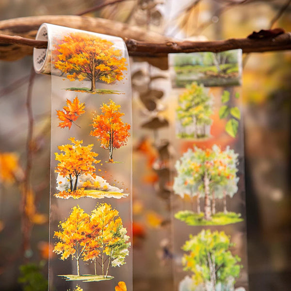 Clear botanical PET tape featuring vibrant autumn trees and foliage for journaling and crafts.