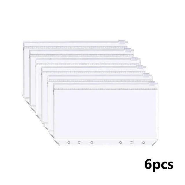 Six identical A6 budget planners with leather covers and envelope systems stacked in a row