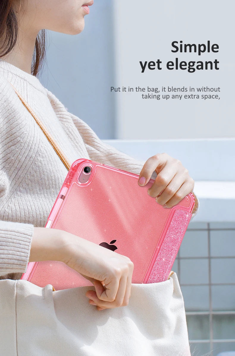 A hand holds a pink glittery protective stand cover for an iPad inside a light-colored bag.