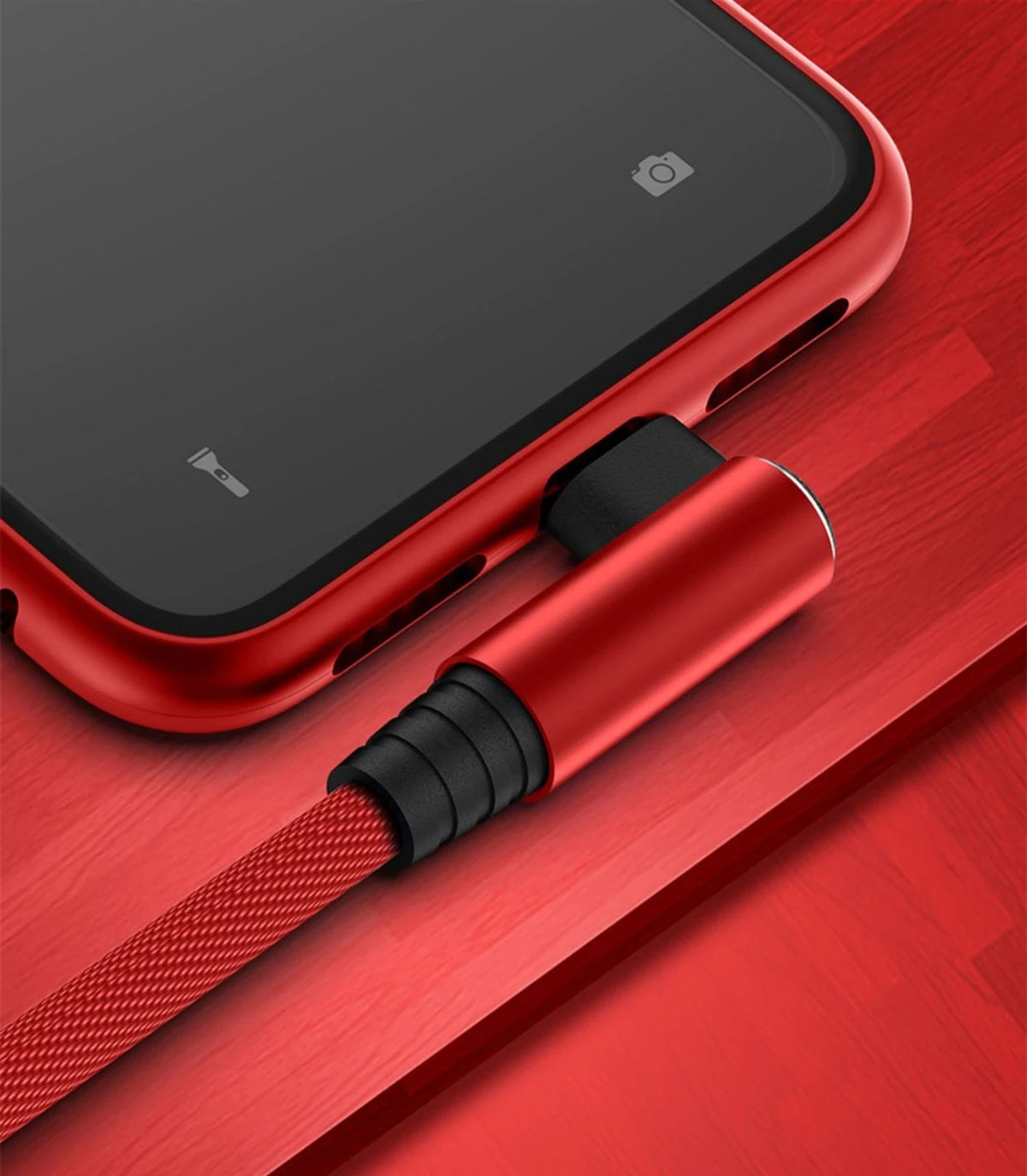 A red 90 degree elbow lightning cable with a braided cord is shown next to an iPhone.
