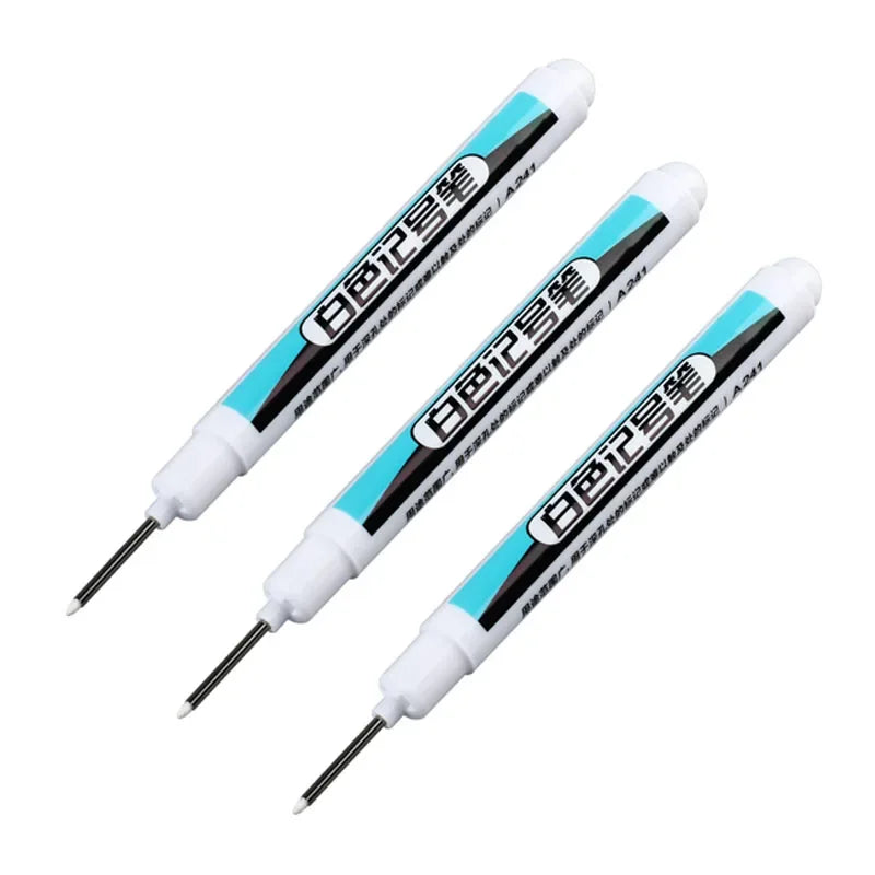 Three white permanent paint marker pens with black and blue accents shown diagonally.