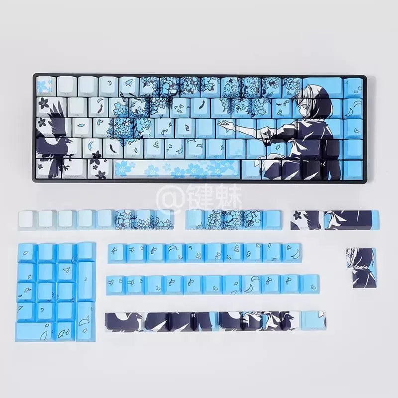 A set of Raven Sakura theme PBT mechanical keycaps featuring blue and black designs.