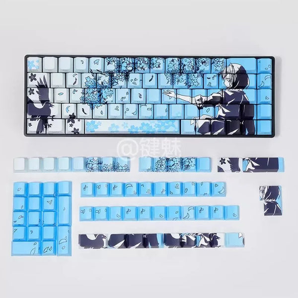 A set of Raven Sakura theme PBT mechanical keycaps featuring blue and black designs.