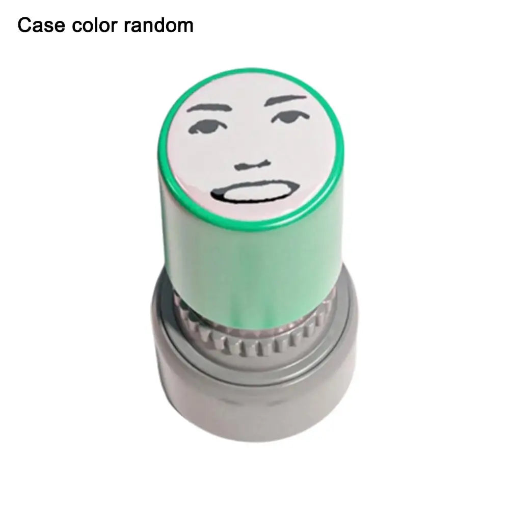 A round rubber stamp with a face design on the top, featuring a light green color.