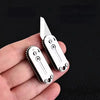 A stainless steel pocket knife with a blade and handle is held in a hand against a dark background.