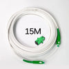 A coil of white single-mode fiber optic cable with green connectors is shown on a white background.