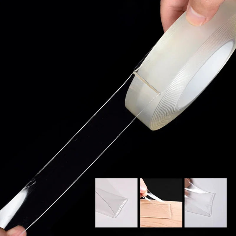 A hand is applying heavy duty clear double-sided gap tape to a surface, showing the tape's clear, flexible nature.
