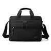 Black Oxford cloth crossbody briefcase with a laptop compartment and shoulder straps