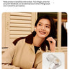 A woman wearing a beige jacket is shown next to a close-up of a white Bluetooth headphone product.