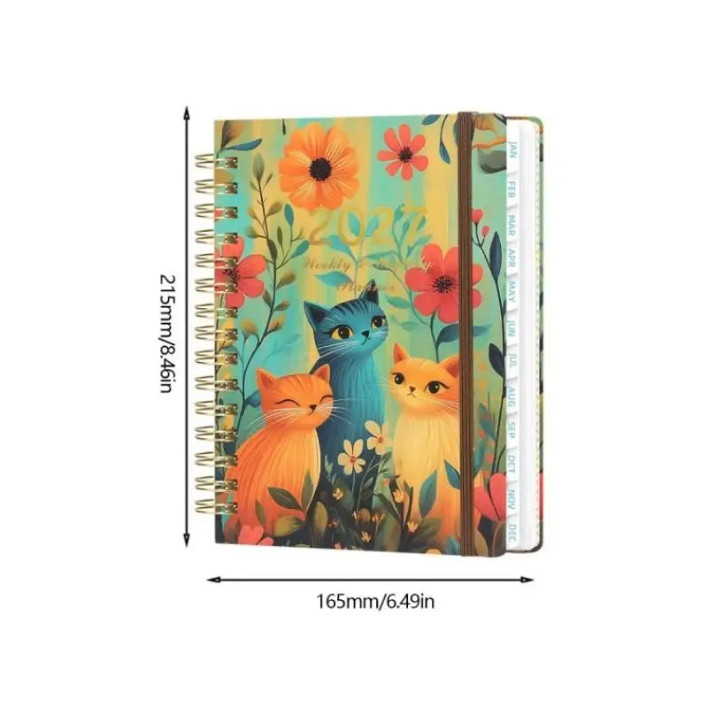 A5 spiral bound planner featuring a floral design with animal illustrations and monthly tabs.