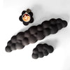 Un set de trois repose-poignets en forme de nuage noir, dont un montre une tasse à café.