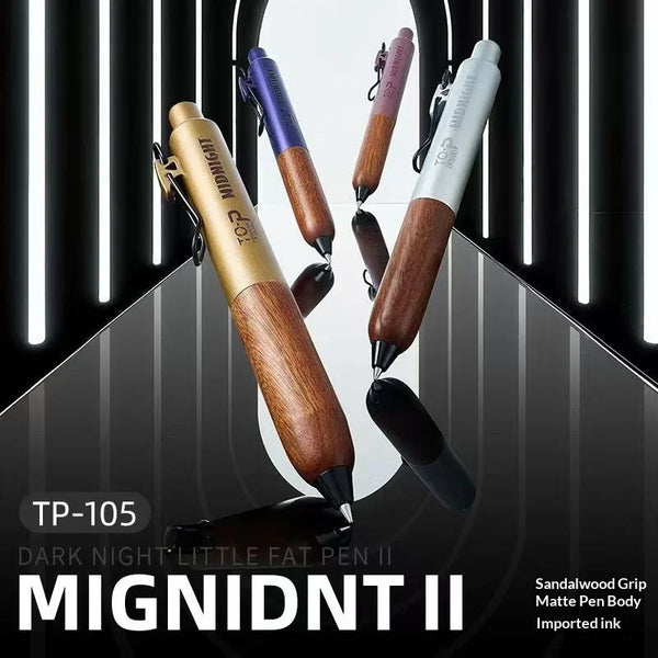 A collection of Mignidt II pens in various colors and finishes displayed against a dark background.