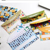 Colorful budget envelopes and planner sheets for tracking cash inflows and outflows
